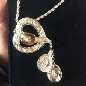 Montana silver buckle necklace with two hanging cowboy hats